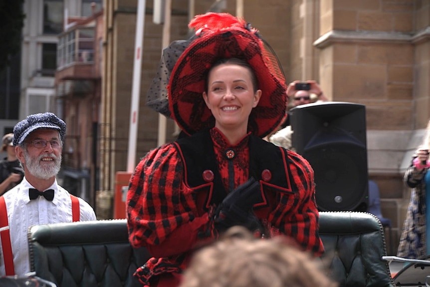 A woman dressed in 19th century costume.
