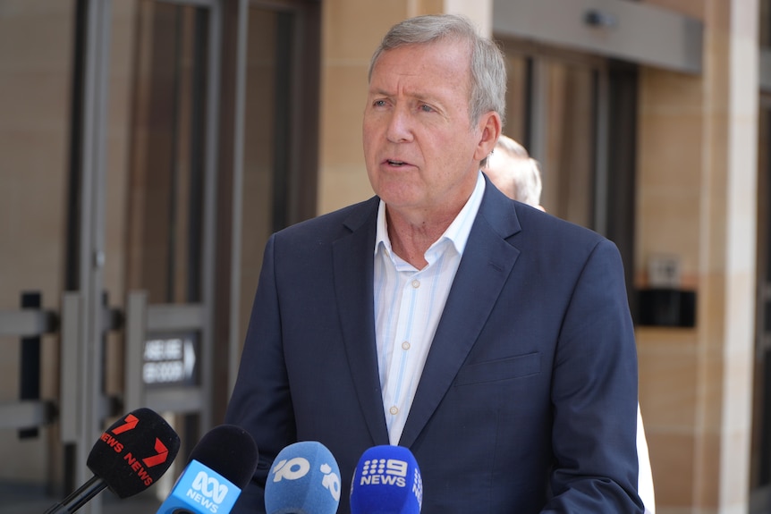 WA Police Minister Reece Whitby speaks to reporters. 