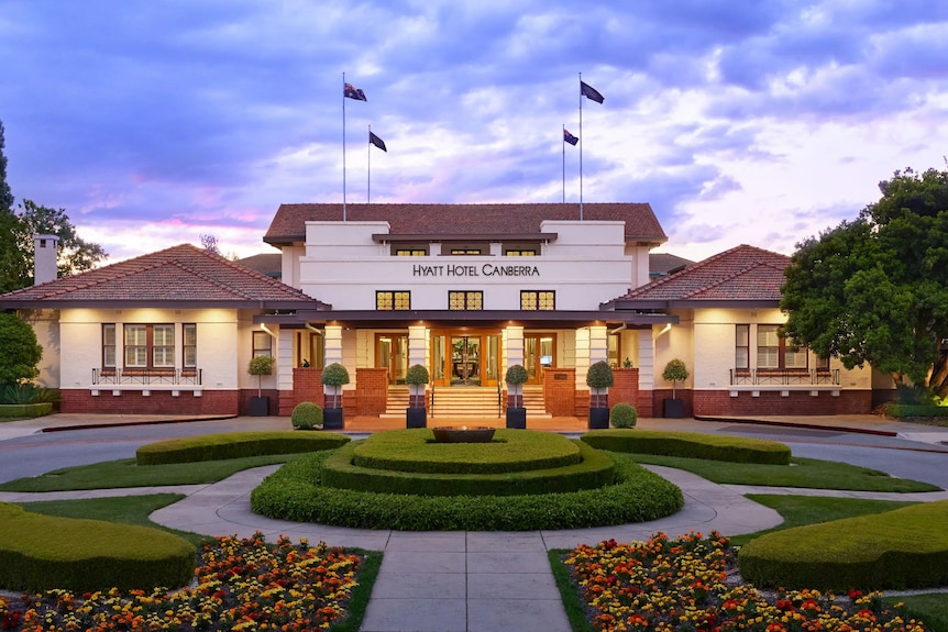 The front of the Hyatt Hotel Canberra at sunset.