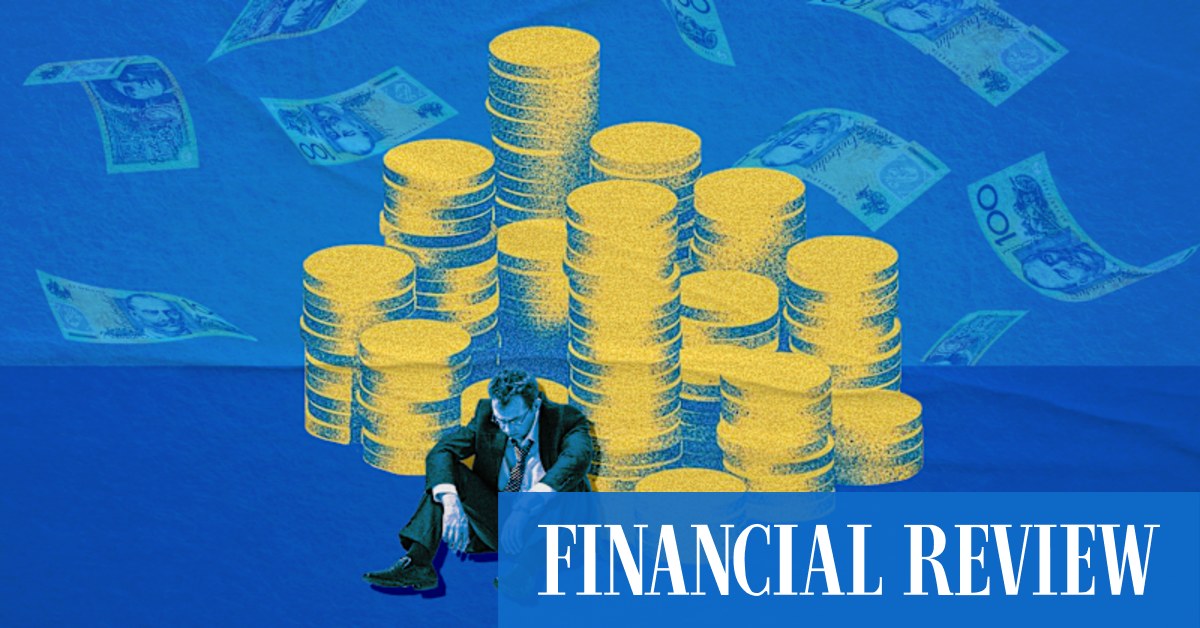 A businessman slumped beside a mountain of money, symbolizing the gender pay gap and the $US267,600 career earnings penalty for agreeable individuals.