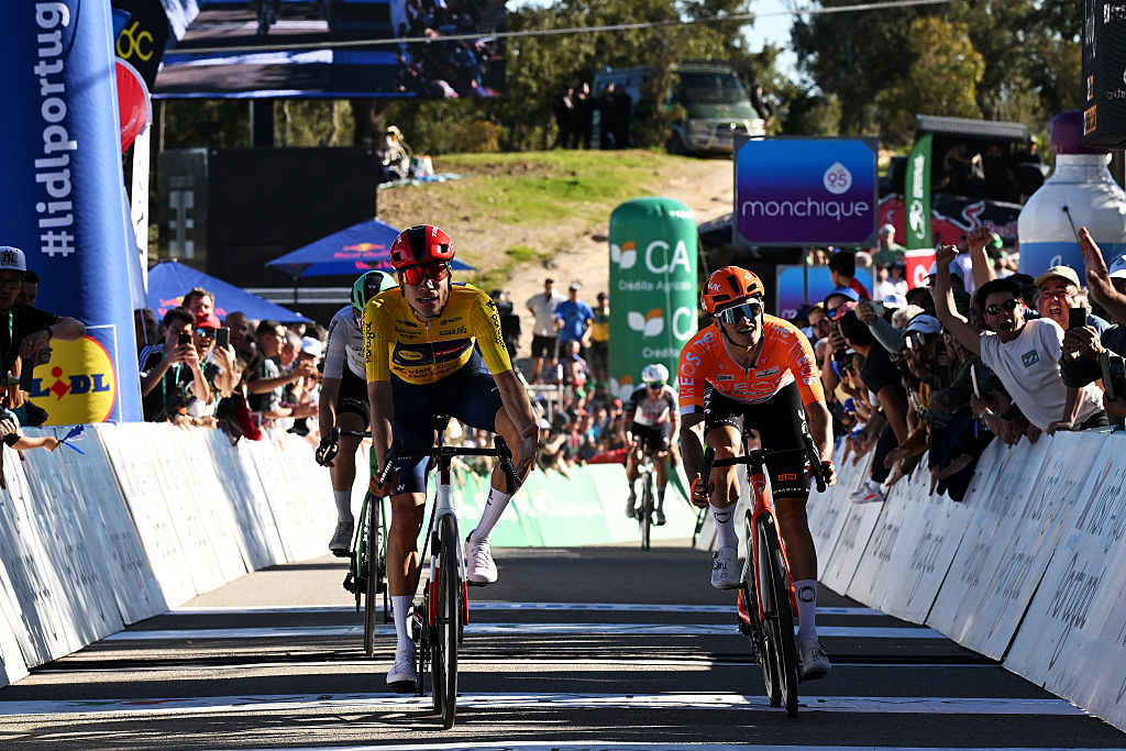 LOULE, PORTUGAL - FEBRUARY 22: (L-R) Juan Ayuso of Spain and Team Lidl - Trek - Yellow leader jersey celebrates at finish line as stage winner ahead of Oscar Onley of Great Britain and Team INEOS Grenadiers during the 52nd Volta ao Algarve em Bicicleta 2026, Stage 5 a 148.4km stage from Faro to Malhao - Loule 512m on February 22, 2026 in Loule, Portugal. (Photo by Dario Belingheri/Getty Images)