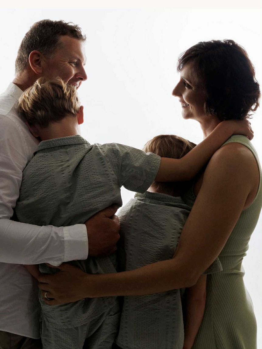 Portrait photo of man, woman and two boys