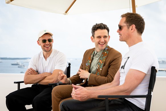 From left, director Harry Lighton with his stars, Harry Melling and Alexander Skarsgård, at last year’s Cannes Film Festival.