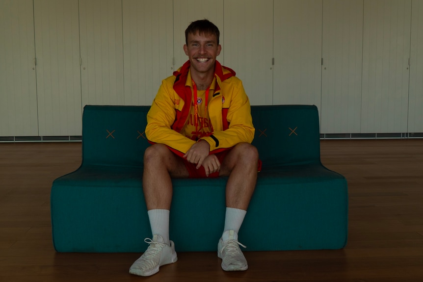 Man sitting on couch.