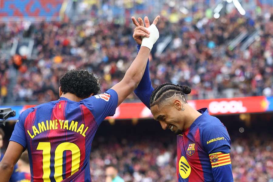 Barcelona's Lamine Yamal celebrates scoring with Raphinha