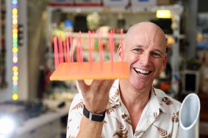 Artist Anton Lord in his home studio with prototypes of his sculpture.