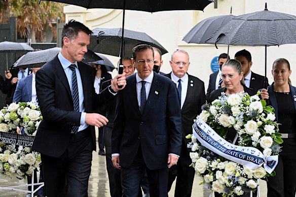 Israeli President Isaac Herzog (centre) and his wife the first lady of Israel Michal Herzog with NSW Premier Chris Minns during their visit to Bondi Pavilion. 