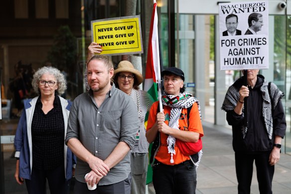 Palestine Action Group members and supporters outside the Supreme Court ahead of today’s urgent hearing. 