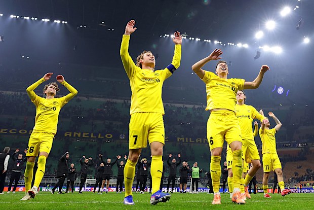 Bodo/Glimt players celebrate in front of the fans.