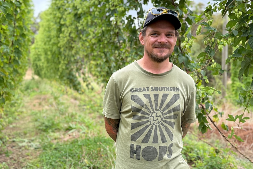 A man standing in his hops crop