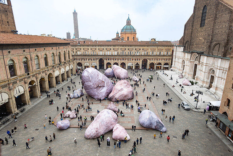 ENESS installs luminous inflatable boulders in bologna's historic piazza maggiore