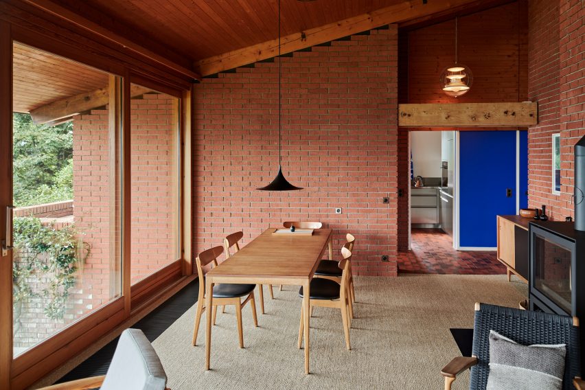 Dining table in renovated house in Vernate by Enrico Sassi