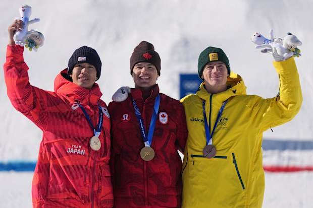 The 'dad podium', from left, silver medallist Ikuma Horishima, gold medallist Mikael Kingsbury and bronze medallist Matt Graham.