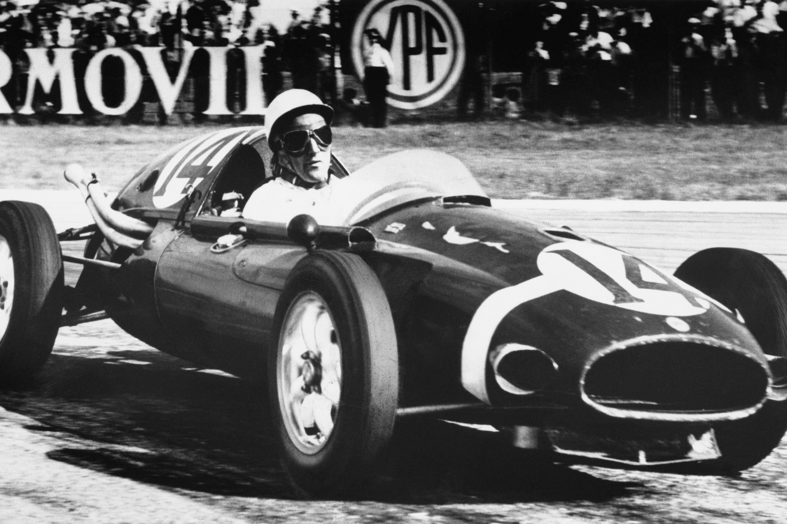 Moss in his Cooper on his way to victory in the 1958 Argentine Grand Prix using tyre management to beat the Ferraris