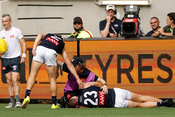 Jacob Weitering is treated after his injury.