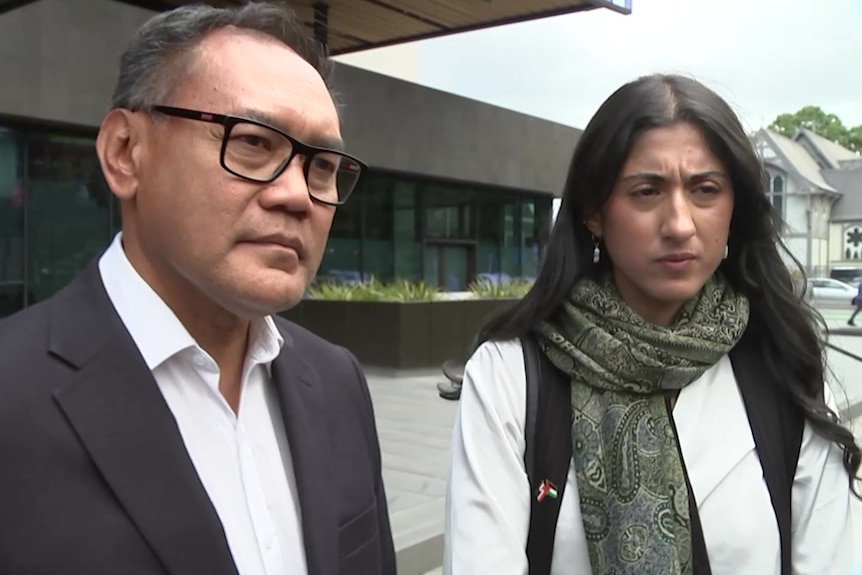 Rashid Omar and Sara Qasem outside court