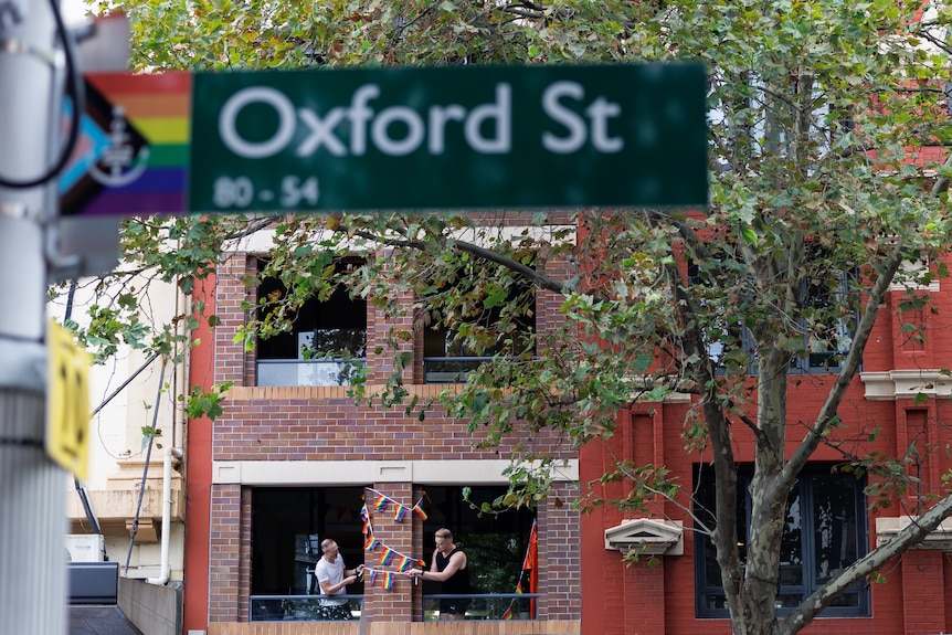 Parade goers set up rainbow bunting ahead of the 46th annual Gay and Lesbian Mardi Gras parade