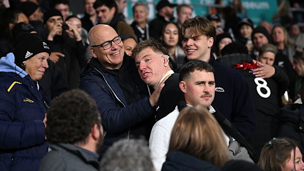 Fabian Holland of New Zealand with his family at Forsyth Barr Stadium.