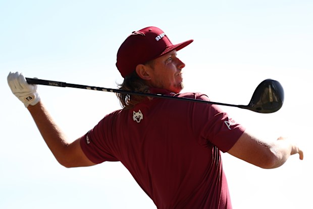 Cameron Smith of Australia tees off at the Australian Open.
