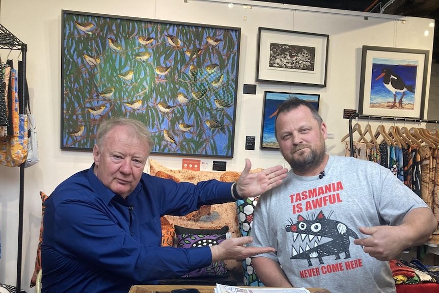 Mike Bowers left with Jon Kudelka, who is wearing a t-shirt that says 'Tasmania is awful, never come here'.