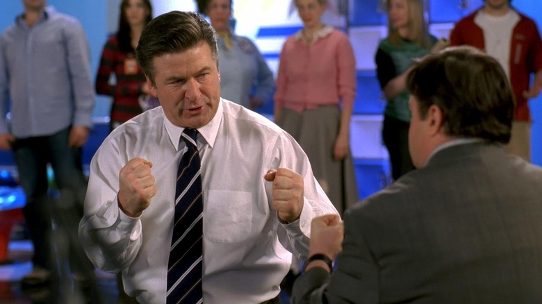 Jack Donaghy raises his fists to another man