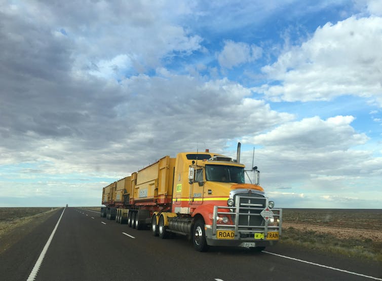 road train, big truck on Australian outback road.