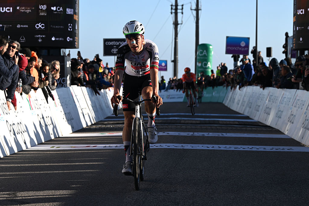 FOIA, PORTUGAL - FEBRUARY 19: Joao Almeida of Portugal and UAE Team Emirates - XRG crosses the finish line during the 52nd Volta ao Algarve em Bicicleta 2026, Stage 2 a 183.5km stage from Portimao to Foia (Monchique) 882m on February 19, 2026 in Foia, Portugal. (Photo by Dario Belingheri/Getty Images)