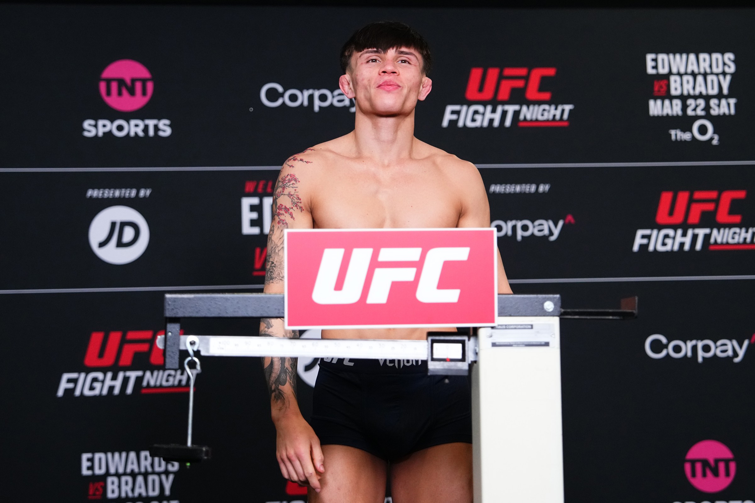 LONDON, ENGLAND - MARCH 21: Lone’er Kavanagh of England poses on the scale during the UFC Fight Night official weigh-in at The Hilton London Canary Wharf on March 21, 2025 in London, England. (Photo by Jeff Bottari/Zuffa LLC)