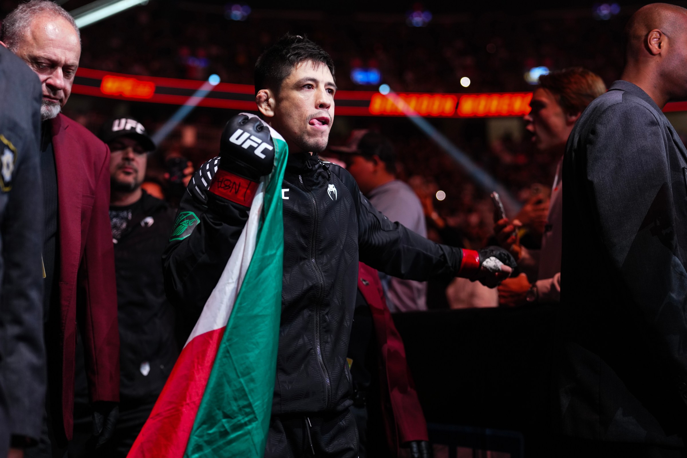 LAS VEGAS, NEVADA - DECEMBER 06: Brandon Moreno of Mexico walks to the Octagon prior to his flyweight fight against Tatsuro Taira of Japan during the UFC 323 event at T-Mobile Arena on December 06, 2025 in Las Vegas, Nevada. (Photo by Cooper Neill/Zuffa LLC)