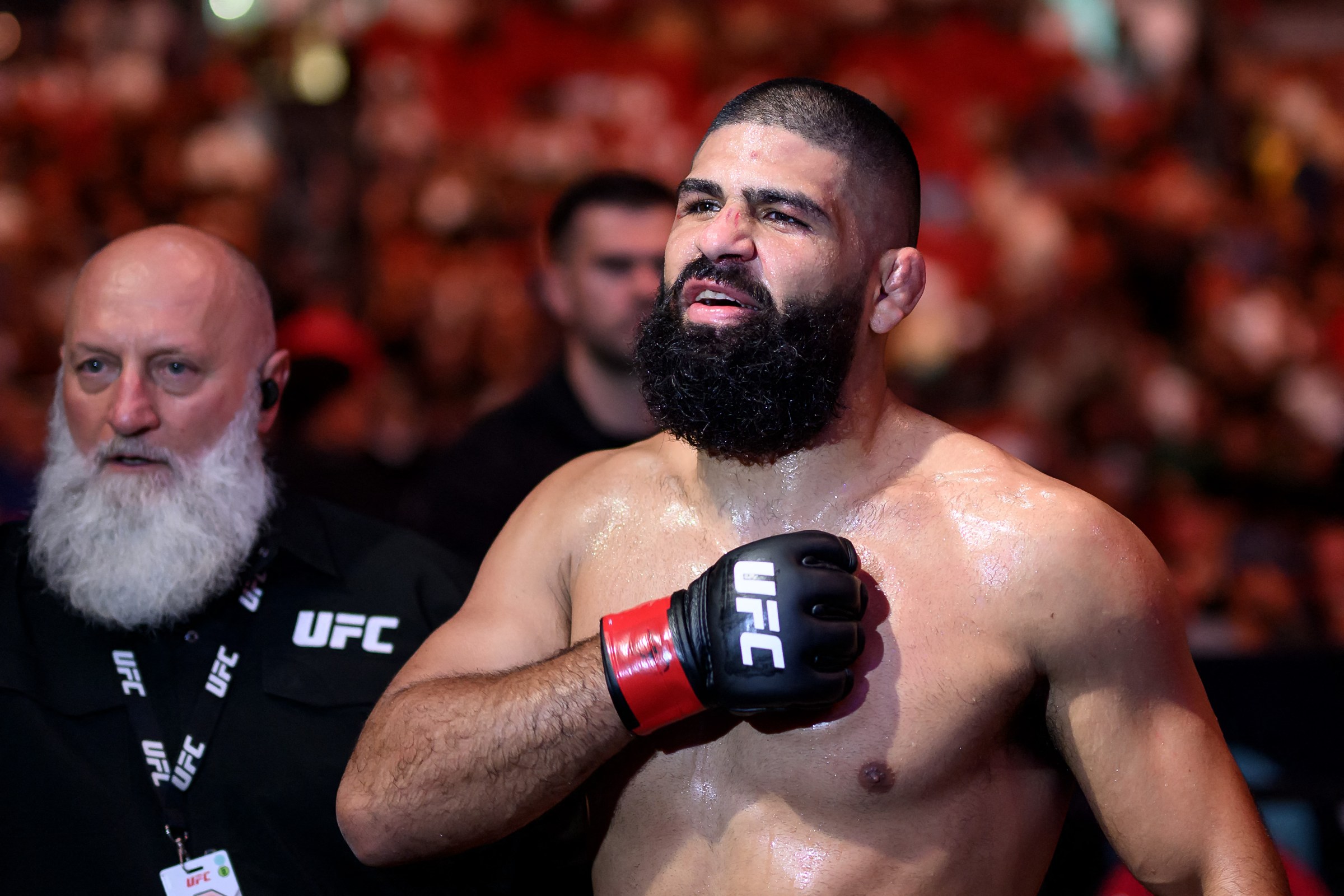 Australia’s Jacob Malkoun (R) reacts following his fight against USA’s Torrez Finney during the Ultimate Fighting Championship (UFC) 325 at Qudos Bank Arena in Sydney on February 1, 2026. (Photo by STEVEN MARKHAM / AFP via Getty Images) / --IMAGE RESTRICTED TO EDITORIAL USE - STRICTLY NO COMMERCIAL USE--