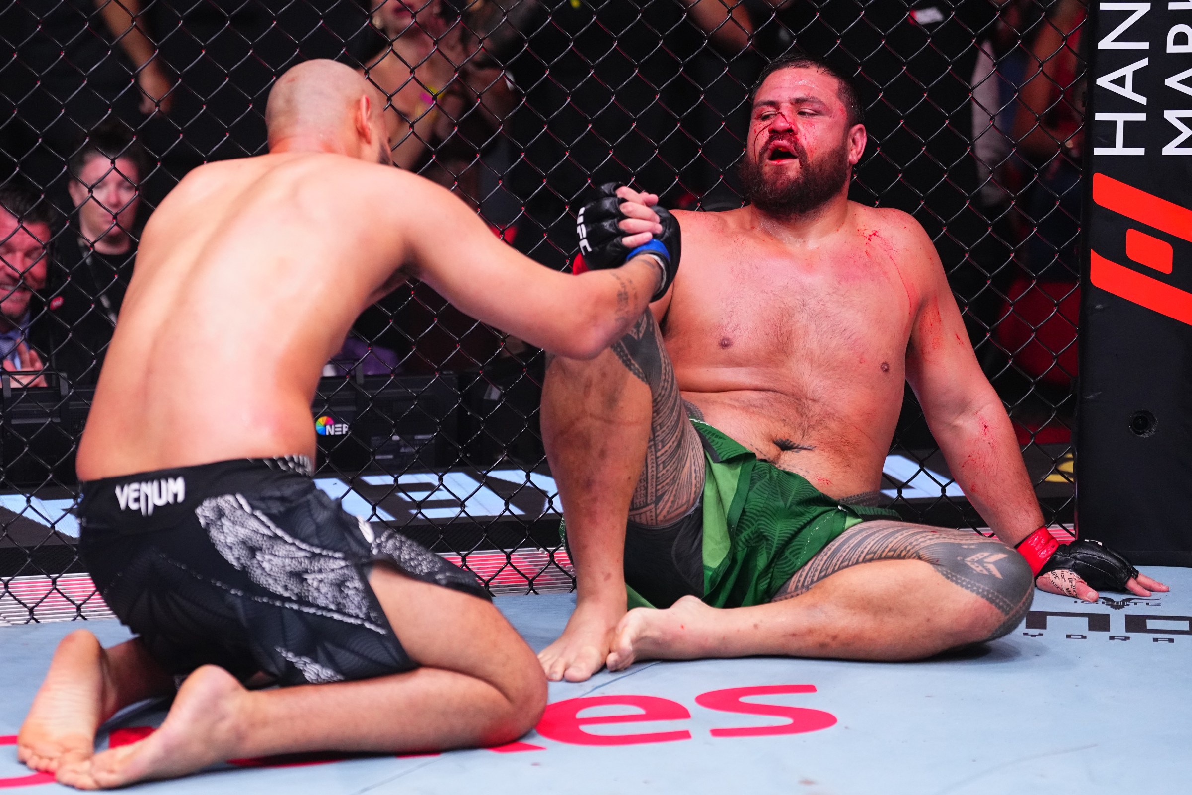 SYDNEY, AUSTRALIA - FEBRUARY 01: (R-L) Tai Tuivasa of Australia and Tallison Teixeira of Brazil react after a heavyweight fight during the UFC 325 event at Qudos Bank Arena on February 01, 2026 in Sydney, Australia. (Photo by Jeff Bottari/Zuffa LLC)