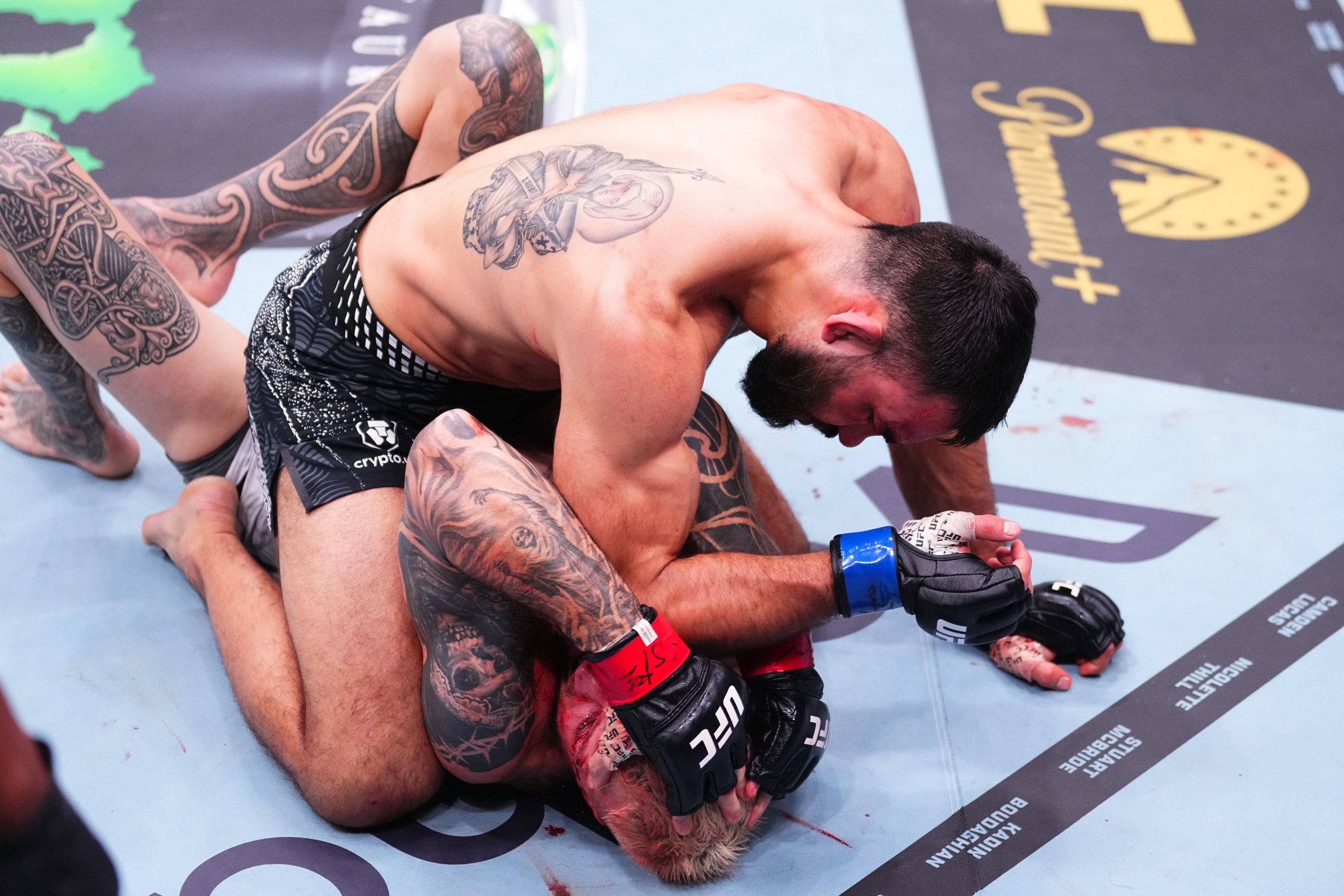 SYDNEY, AUSTRALIA - FEBRUARY 01: (L-R) Benoit Saint Denis of France elbows Dan Hooker of New Zealand in a lightweight fight during the UFC 325 event at Qudos Bank Arena on February 01, 2026 in Sydney, Australia. (Photo by Jeff Bottari/Zuffa LLC)