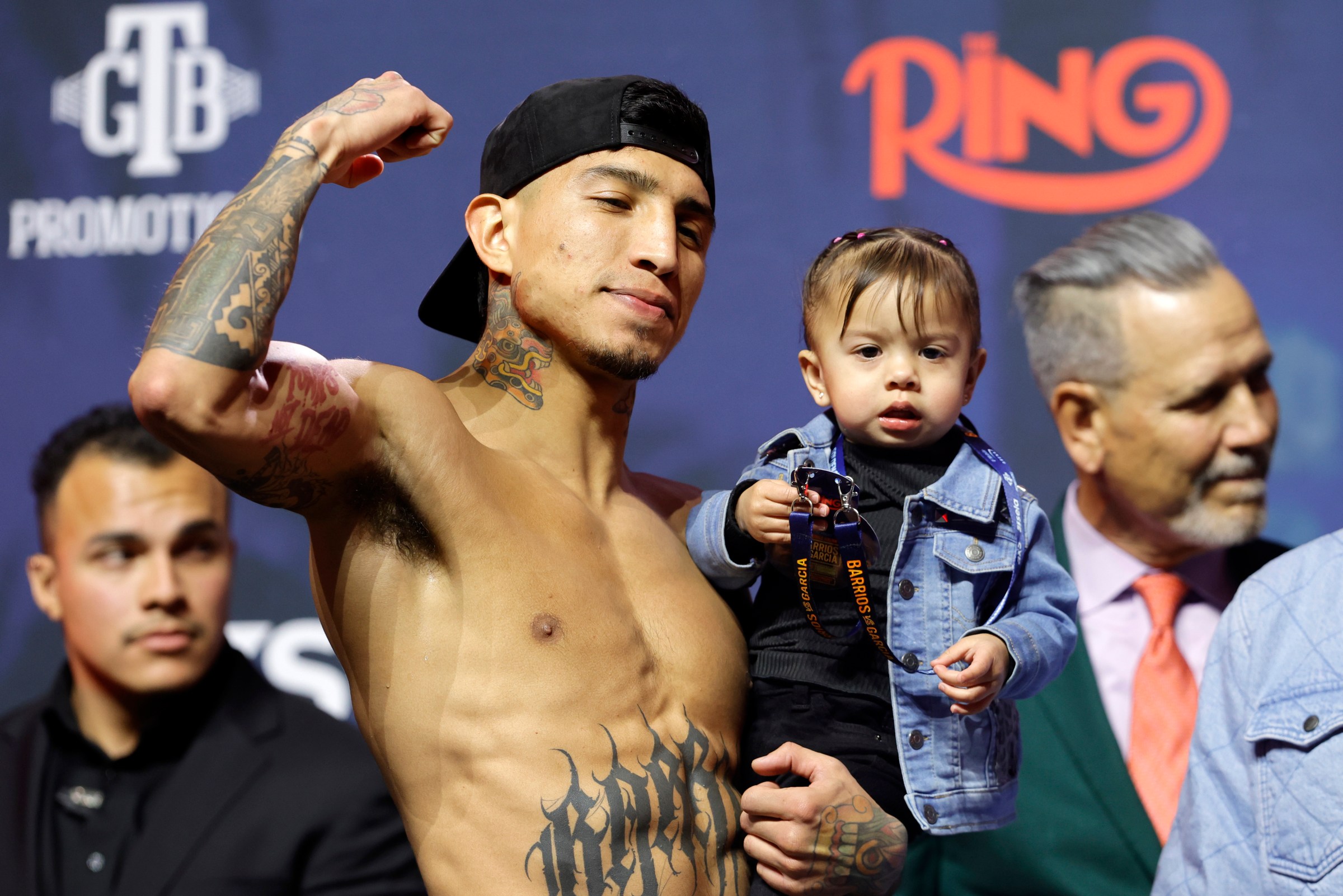 LAS VEGAS, NEVADA - FEBRUARY 20: WBC welterweight champion Mario Barrios poses with his daughter Luna Sofia Barrios during the ceremonial weigh-in at T-Mobile Arena on February 20, 2026 in Las Vegas, Nevada. Barrios is scheduled to defend his title against Ryan Garcia on February 21. (Photo by Steve Marcus/Getty Images)