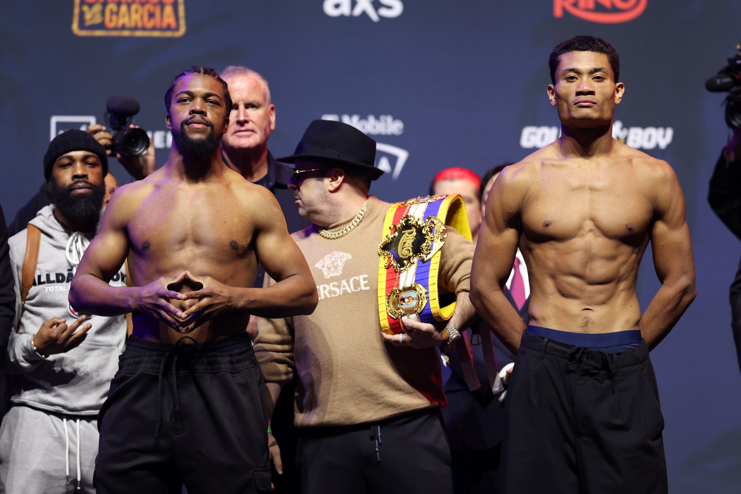 LAS VEGAS, NEVADA - FEBRUARY 20: Gary Antuanne Russell (L) and Andy Hiraoka (R) face off during weigh ins ahead of their WBA Super Lightweight Title bout at T-Mobile Arena on February 20, 2026 in Las Vegas, Nevada. (Photo by Cris Esqueda/Golden Boy/Getty Images)