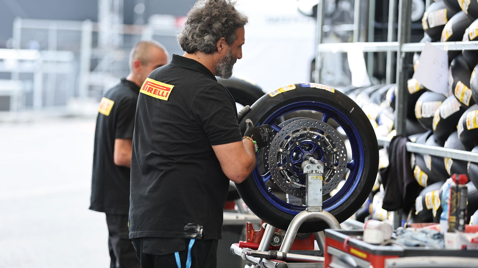 Pirelli tyre fitter, 2024 Czech WorldSBK. Credit: Gold and Goose.