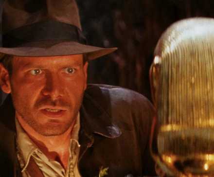 Indiana Jones, played by Harrison Ford, eyes a golden idol in 'Raiders of the Lost Ark'.