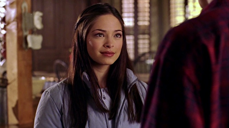 Lana Lang looks up at Clark Kent with a smile on Smallville (2001-2011)