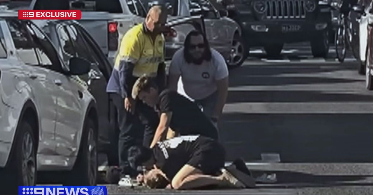 Shirtless driver pinned down in dramatic citizens' arrest on busy road