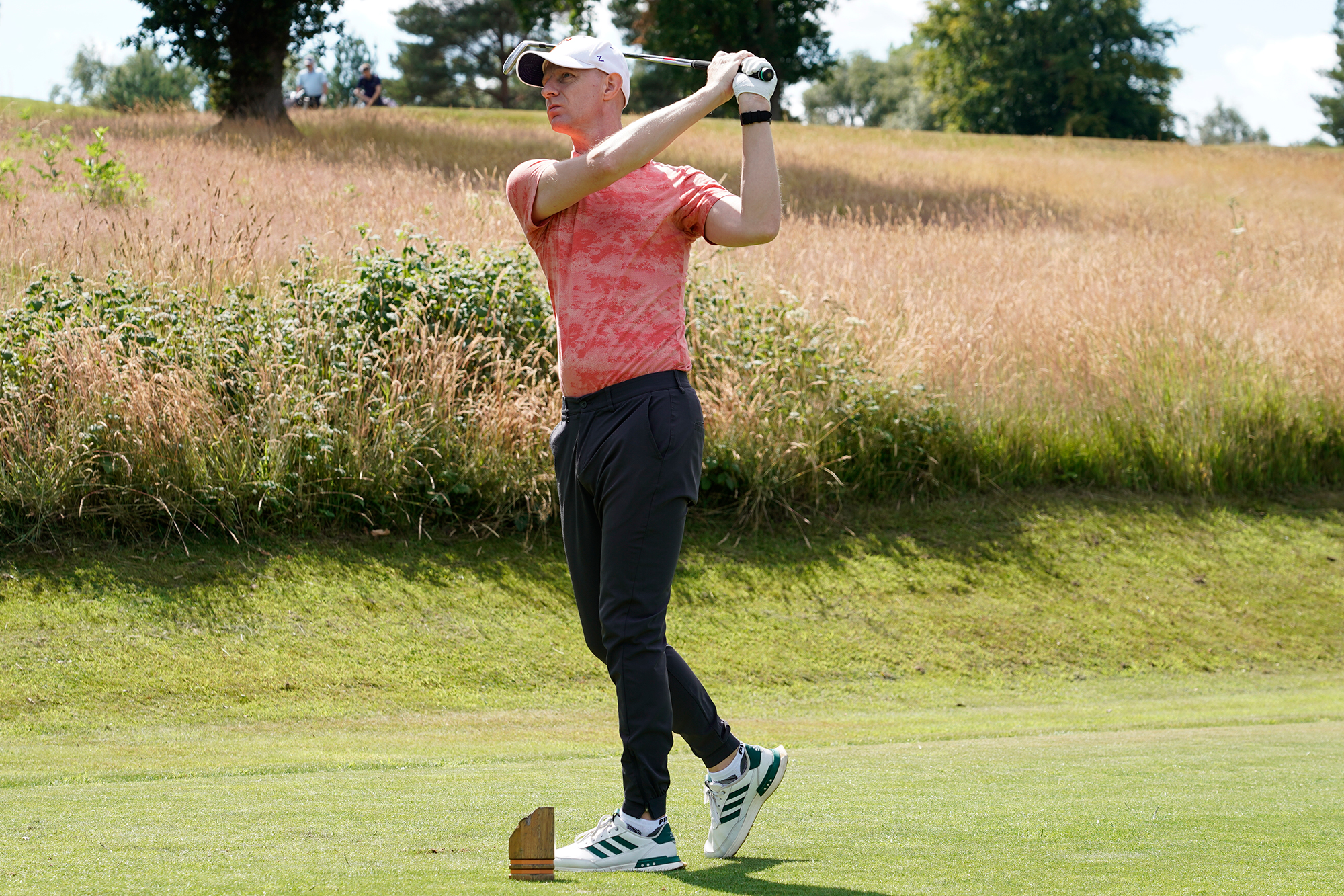 Ged Walters in the finish position after hitting a tee shot on the par-3 17th hole at Sand Moor Golf Club