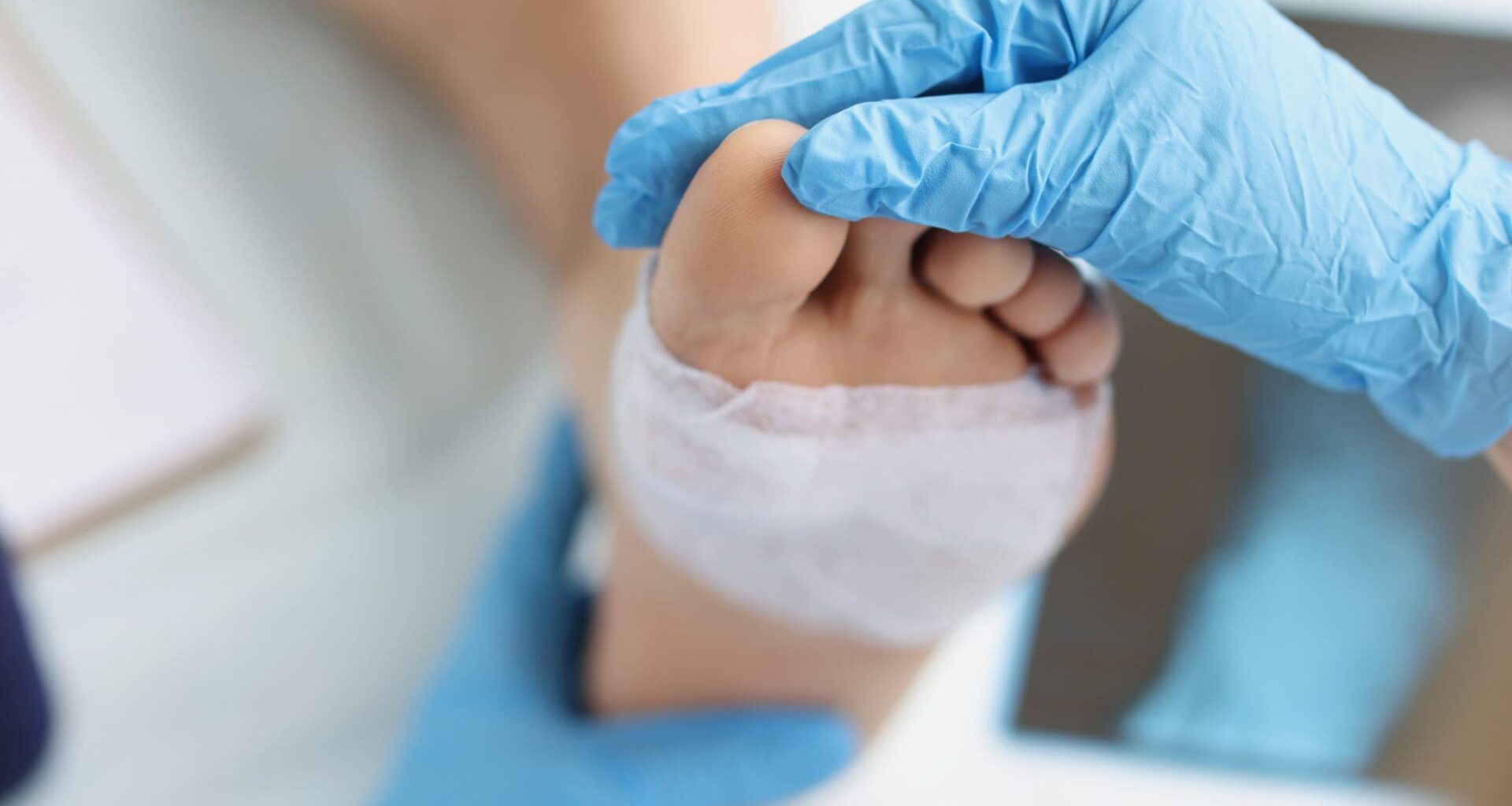 Doctor conducts medical examination of foot with patch. Pain attacks concept