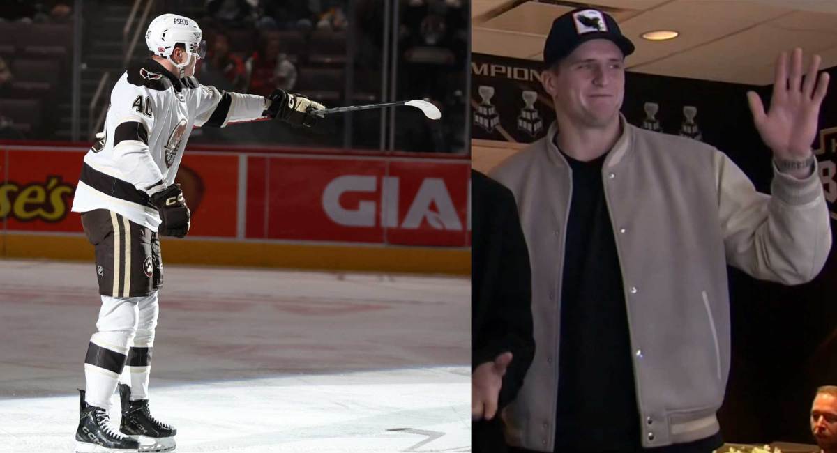 Ilya Protas points to his brother Aliaksei in the stands after scoring 18th goal of season for Hershey
