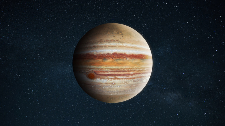 An image of Jupiter in space, a gas planet with stripes of brown, white, red, and orange