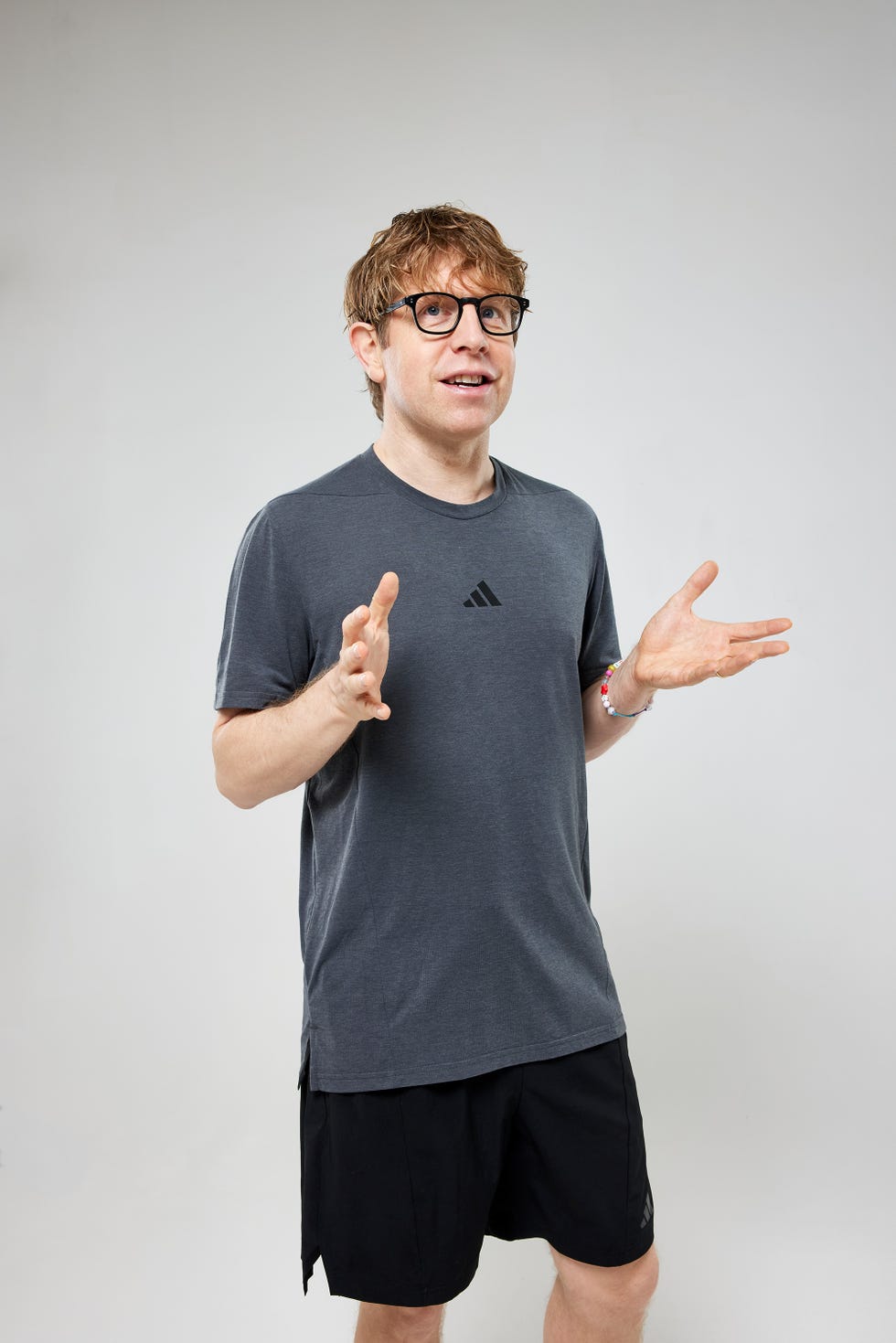 Josh Widdicombe person gesturing with hands while wearing a sports outfit