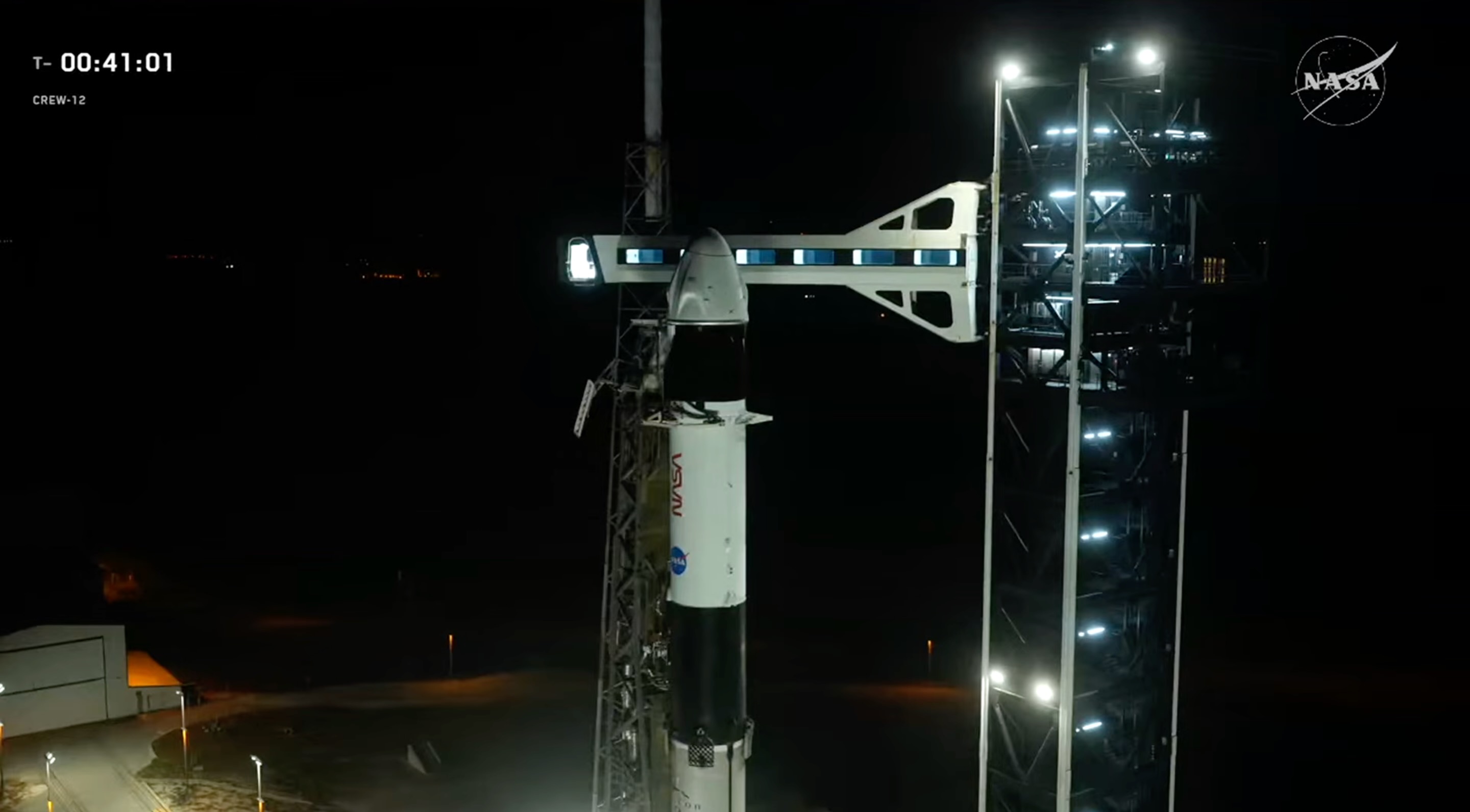The SpaceX Falcon 9 rocket and Crew Dragon capsule "Freedom," which will fly the Crew-12 astronaut mission to the International Space Station, stand on the pad on launch day, Feb. 13, 2026.