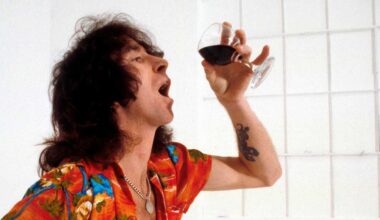 Bon Scott drinking a glass of wine