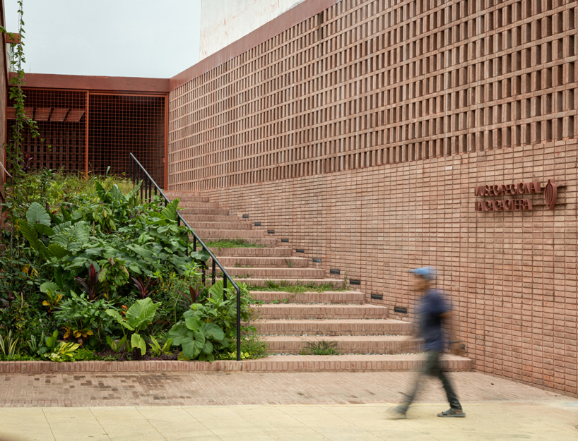 cast in red-pigmented concrete, la cacaotera museum celebrates cacao heritage in mexico - 2