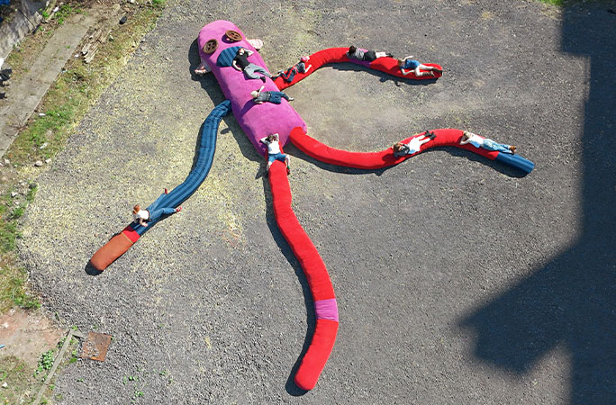 sock monkey lying on the ground