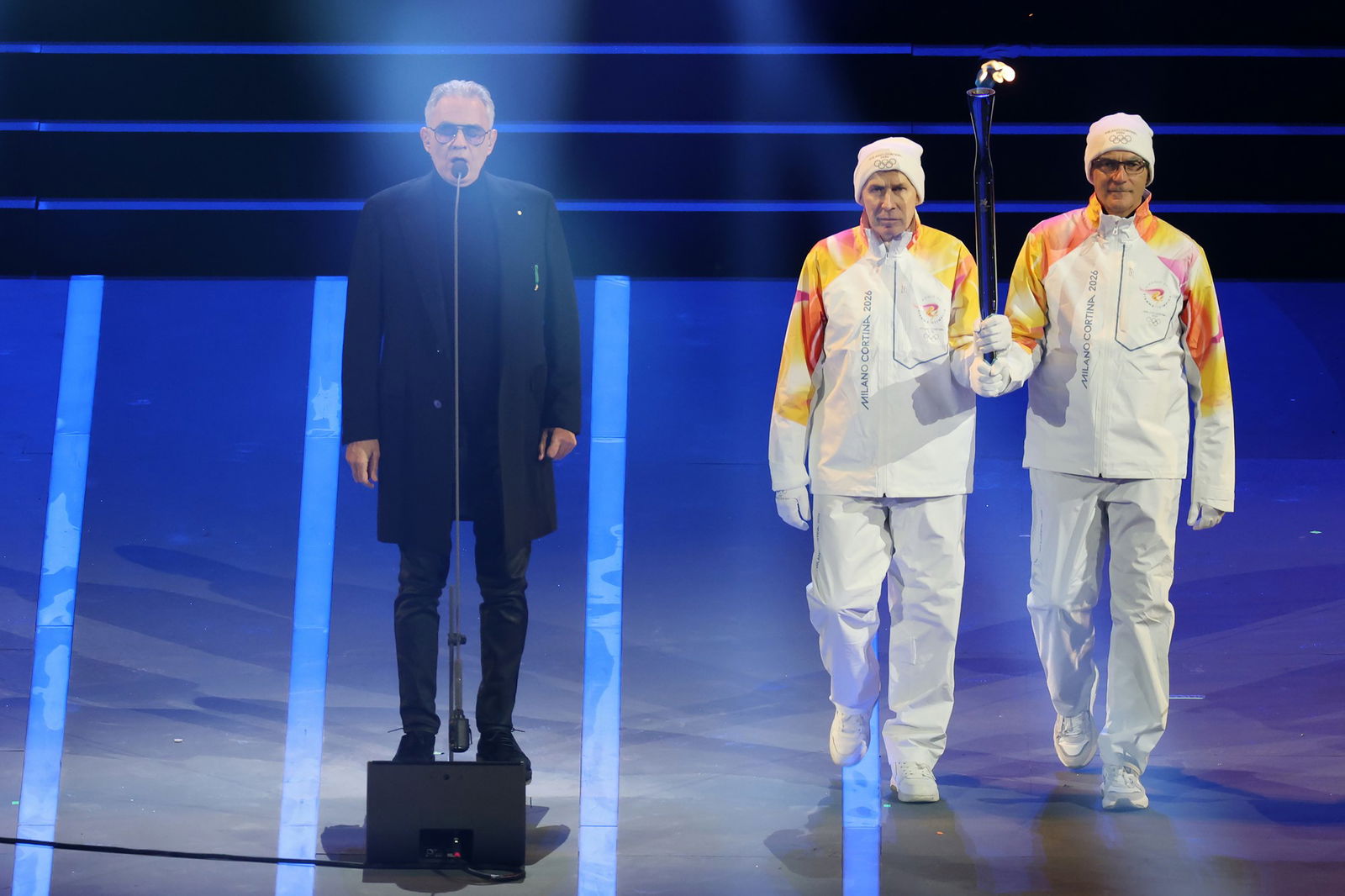 Andrea Boccelli performs as the Olympic flame is carried in the stadium during the opening ceremony of the Milano Cortina 2026 Winter Olympics at San Siro Stadium on February 06, 2026 in Milan, Italy. 
