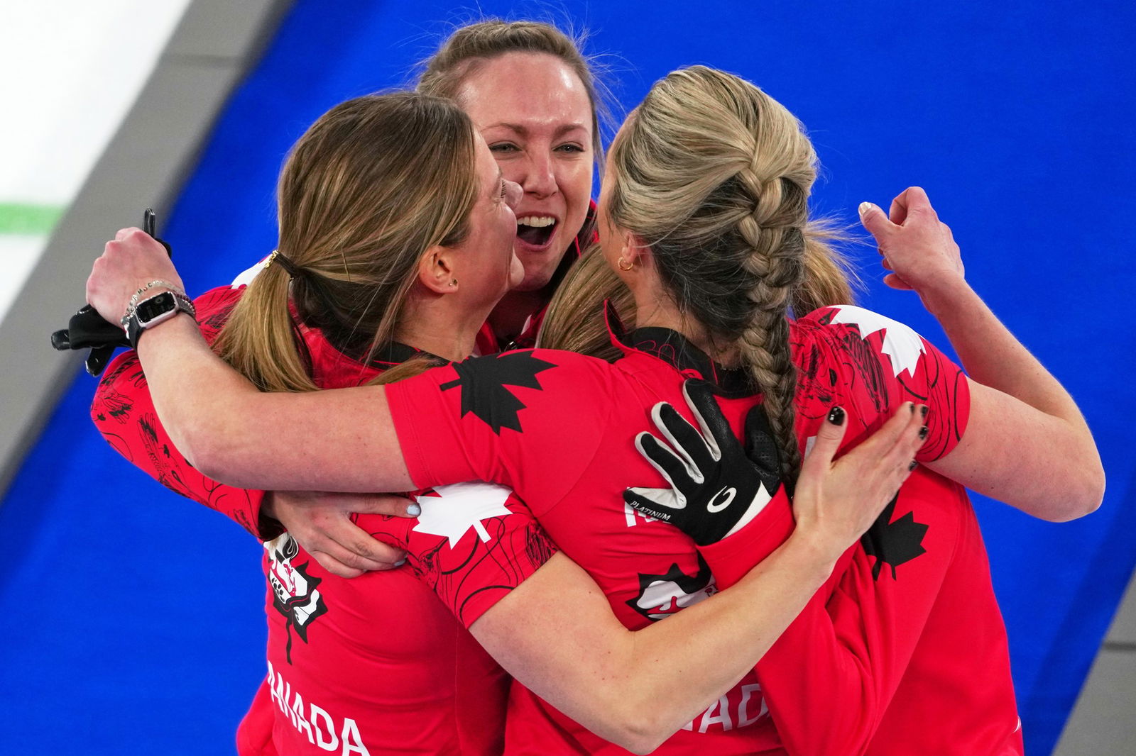 Canada celebrates winning a curling bronze.