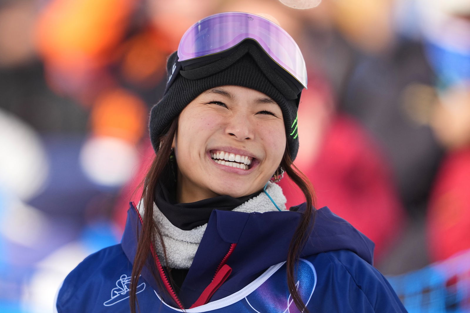 Chloe Kim smiles after competing at Winter Olympics.